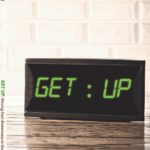 A book titled "GET UP: Moving from Brokenness to God-Given Purpose" by Beth Ruffin, with a digital alarm clock design.